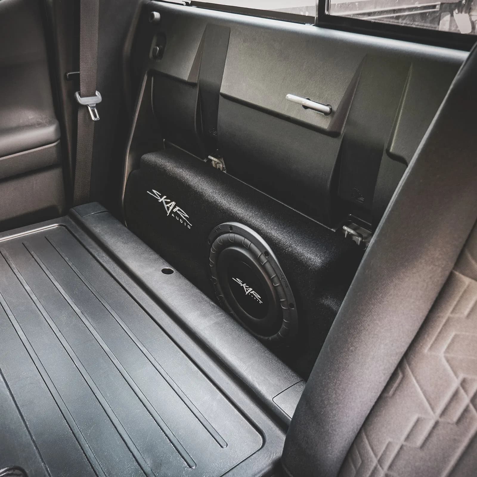 Skar Audio L-VS-1X10TOY-TACOM-2016-UP-DBLCAB enclosure installation example — view 1